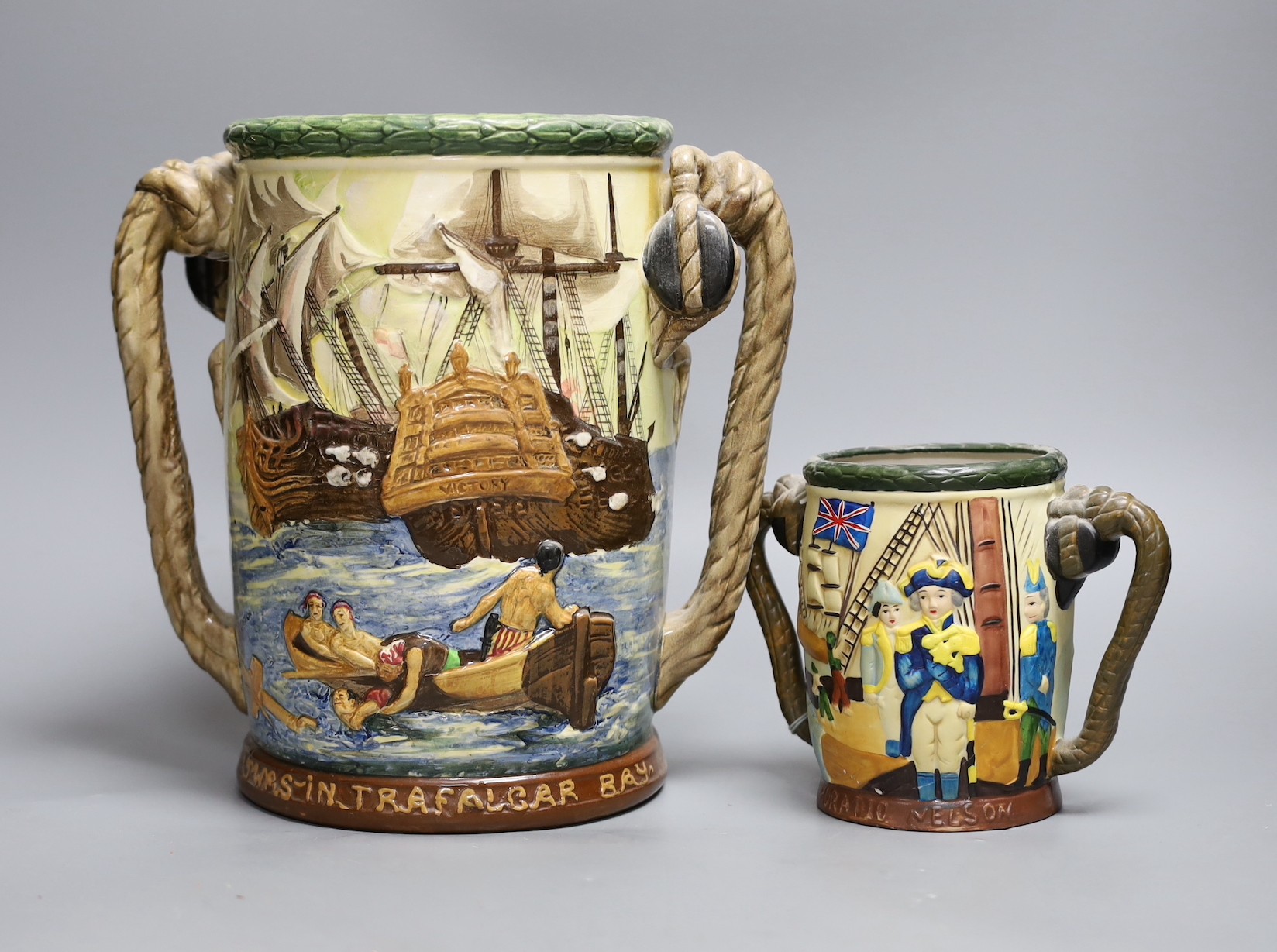 A Royal Doulton Nelson commemorative loving cup, no.453/600, 27cm tall, together with another cup